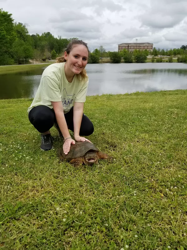 Olivia with a snapping turtle